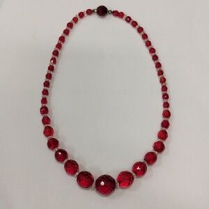 Red and clear bead necklace. 13"